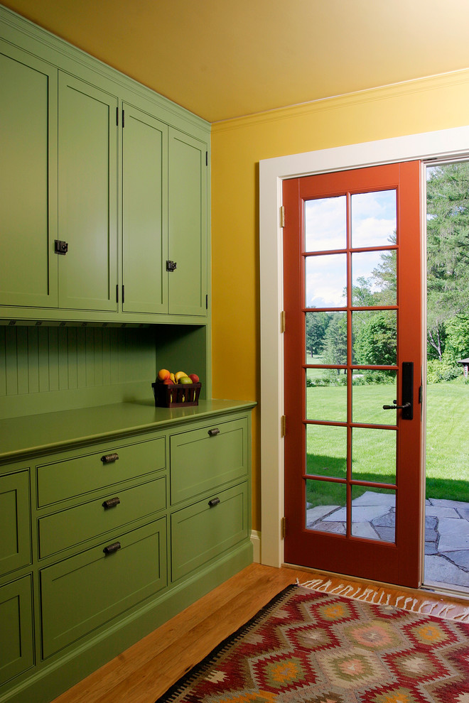 Design ideas for a traditional entryway in Boston with yellow walls and a double front door.