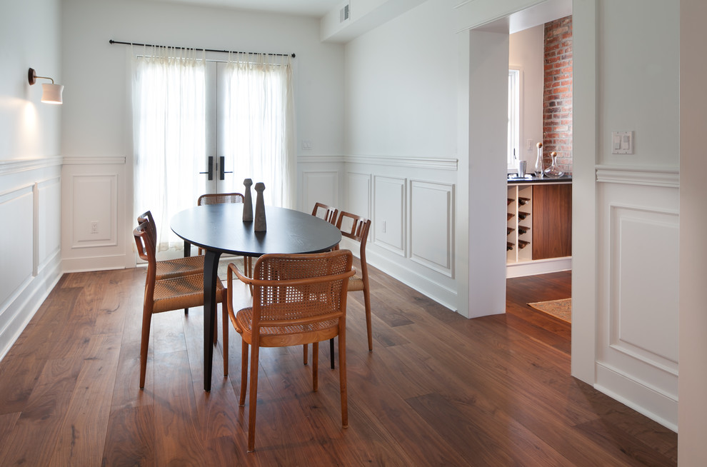 Mid-sized midcentury separate dining room in DC Metro with white walls, dark hardwood floors and no fireplace.