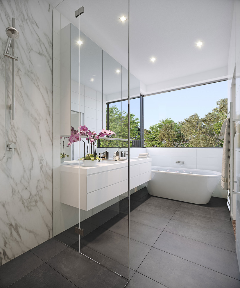 Photo of a contemporary master bathroom in Brisbane with flat-panel cabinets, white cabinets, a freestanding tub, a curbless shower and white walls.