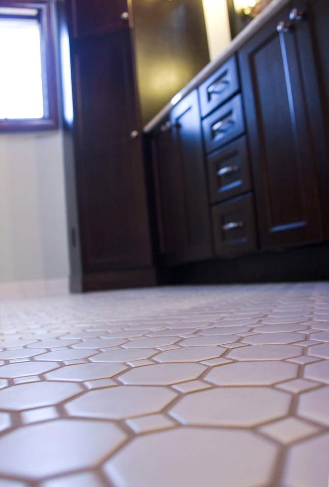 Transitional master white tile and ceramic tile ceramic tile alcove shower photo with an undermount sink, shaker cabinets, dark wood cabinets, marble countertops and blue walls
