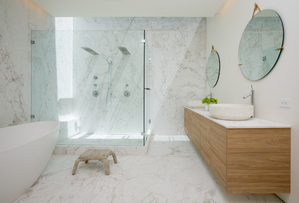 Contemporary master bathroom in San Francisco with a vessel sink, flat-panel cabinets, light wood cabinets, a freestanding tub, a double shower and white walls.
