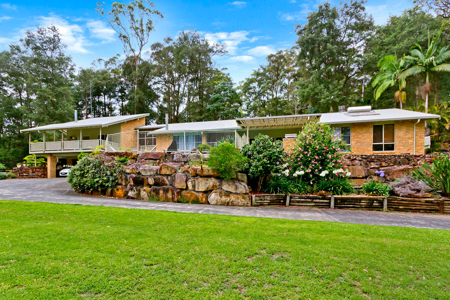 Expansive contemporary split-level brick exterior in Central Coast.