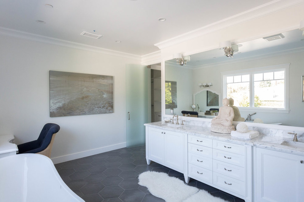 Photo of a large transitional master wet room bathroom in San Francisco with shaker cabinets, white cabinets, a freestanding tub, gray tile, yellow tile, stone slab, white walls, slate floors, an undermount sink and marble benchtops.