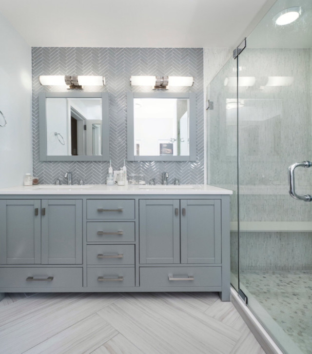 Mid-sized contemporary 3/4 bathroom in New York with shaker cabinets, grey cabinets, an alcove shower, gray tile, porcelain floors, an undermount sink, grey floor and a hinged shower door.