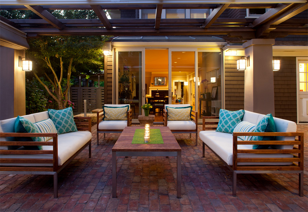 This is an example of a contemporary patio in San Francisco with a pergola.