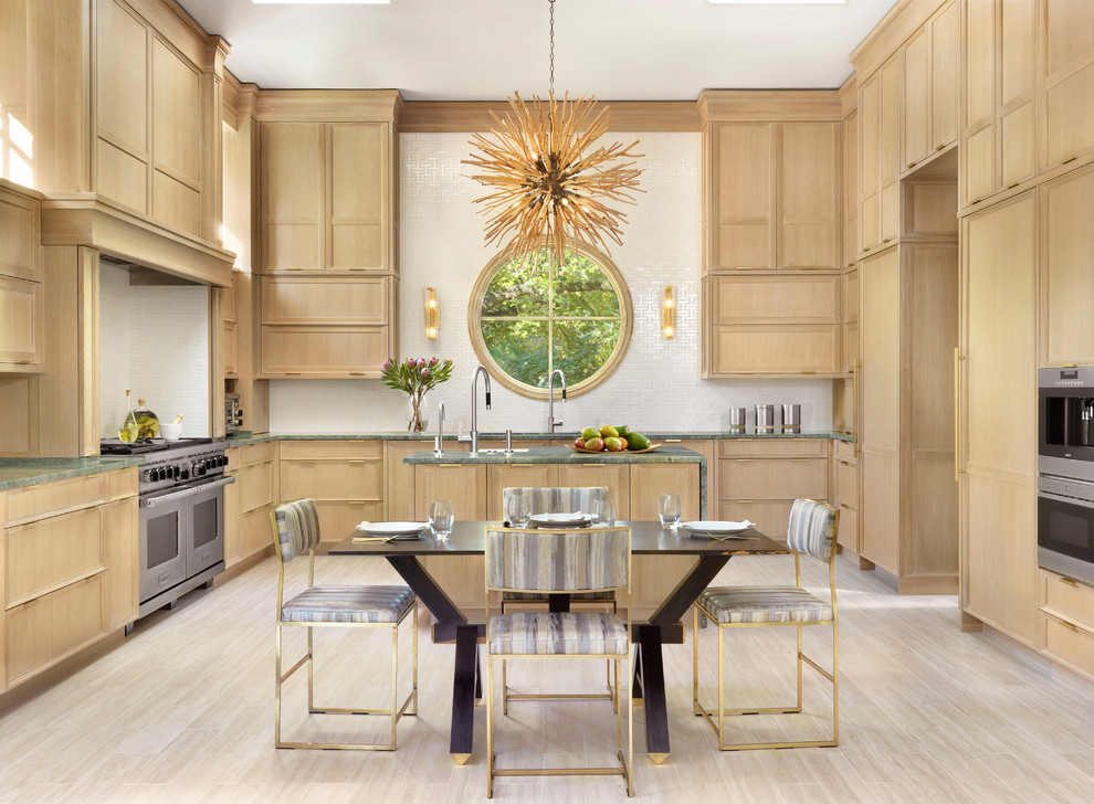 Design ideas for a contemporary u-shaped eat-in kitchen in St Louis with recessed-panel cabinets, light wood cabinets, white splashback, stainless steel appliances, with island, beige floor and green benchtop.