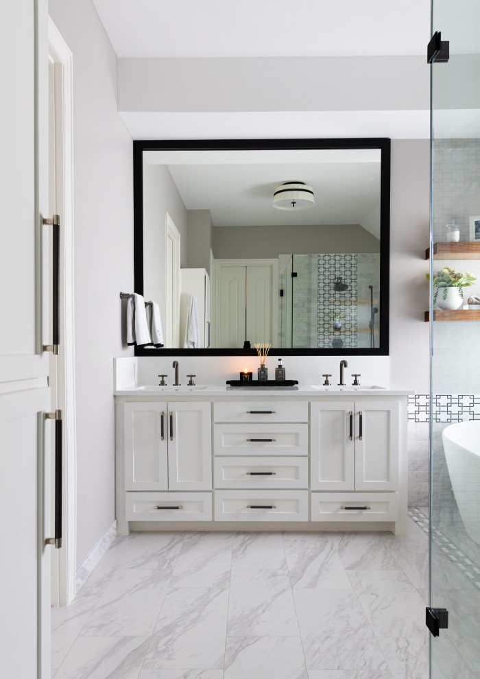Inspiration for a mid-sized transitional master bathroom in Dallas with shaker cabinets, white cabinets, a freestanding tub, white walls, porcelain floors, an undermount sink, engineered quartz benchtops, grey floor, an enclosed toilet, a double vanity and a built-in vanity.