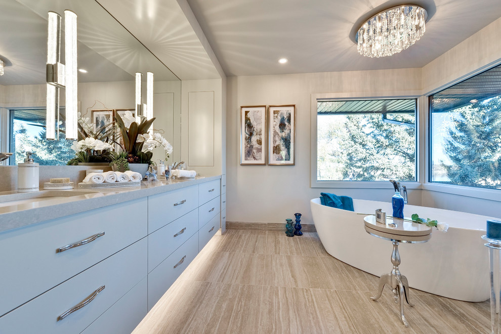 Transitional 3/4 beige floor freestanding bathtub photo in Calgary with flat-panel cabinets, gray cabinets, beige walls, an undermount sink and beige countertops