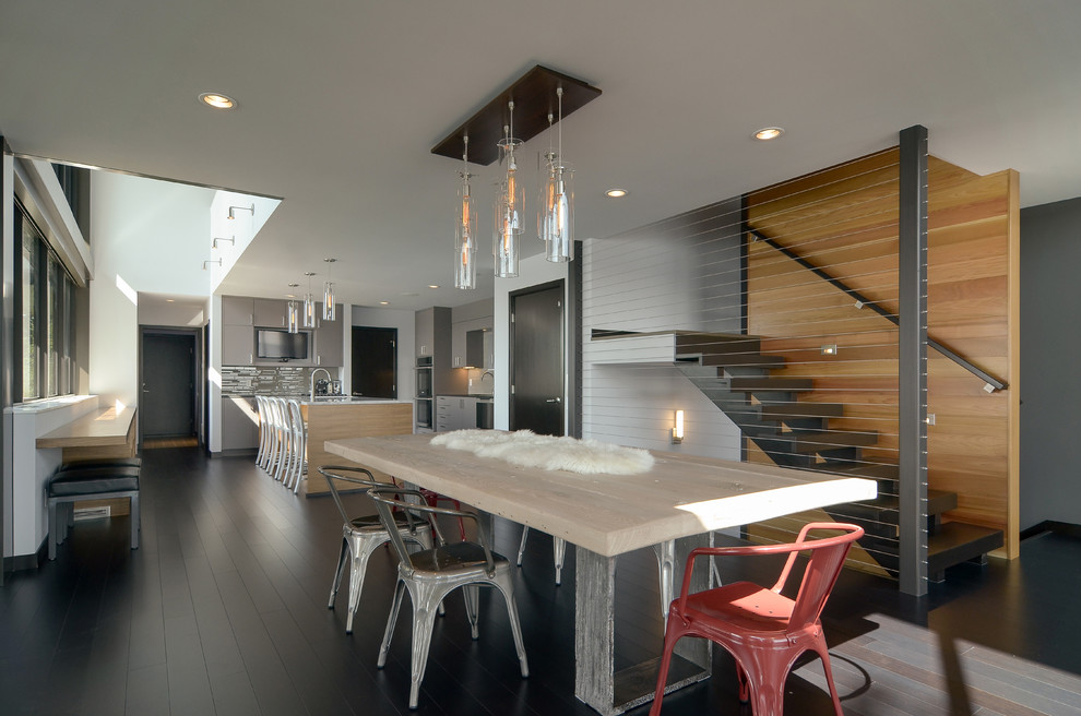 Mid-sized contemporary open plan dining in Minneapolis with grey walls and bamboo floors.