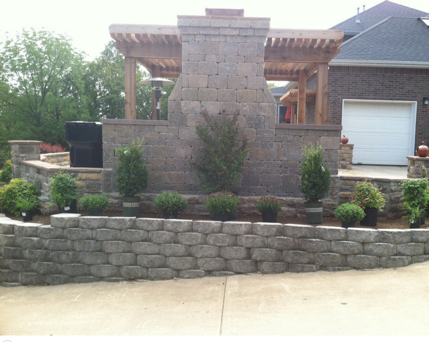 Patio - mid-sized transitional backyard patio idea with a pergola
