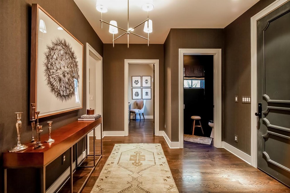 Photo of a small transitional entry hall in Nashville with brown walls, dark hardwood floors, a single front door, a gray front door and brown floor.