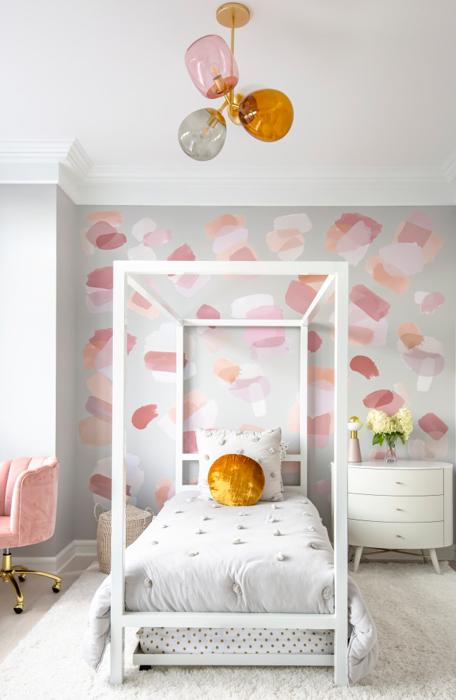 This is an example of a contemporary kids' bedroom for girls in New York with multi-coloured walls, light hardwood floors and beige floor.