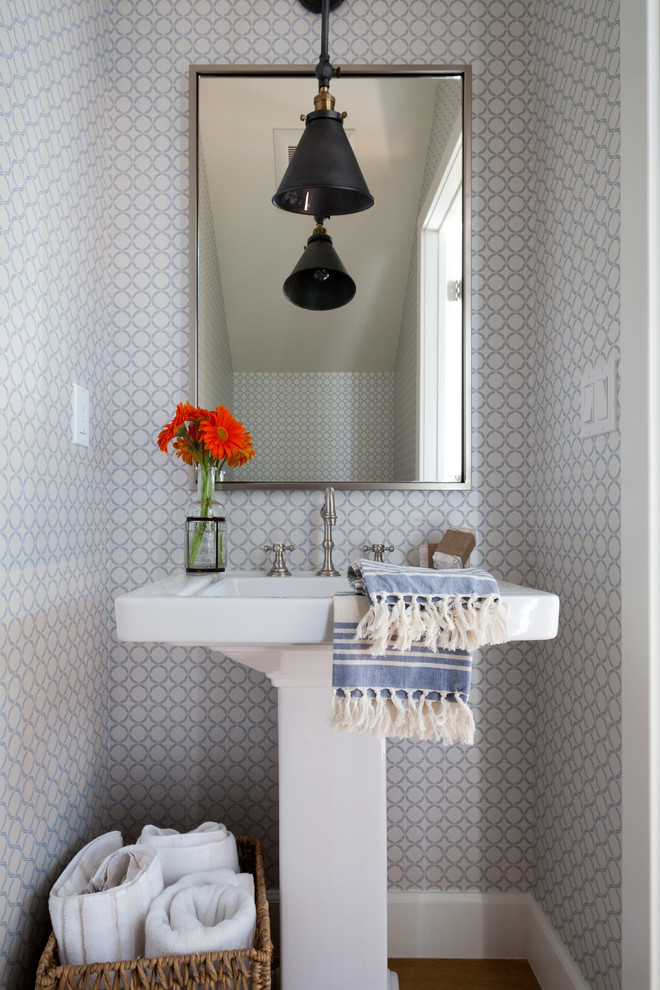 Design ideas for a small beach style powder room in Los Angeles with a pedestal sink and multi-coloured walls.
