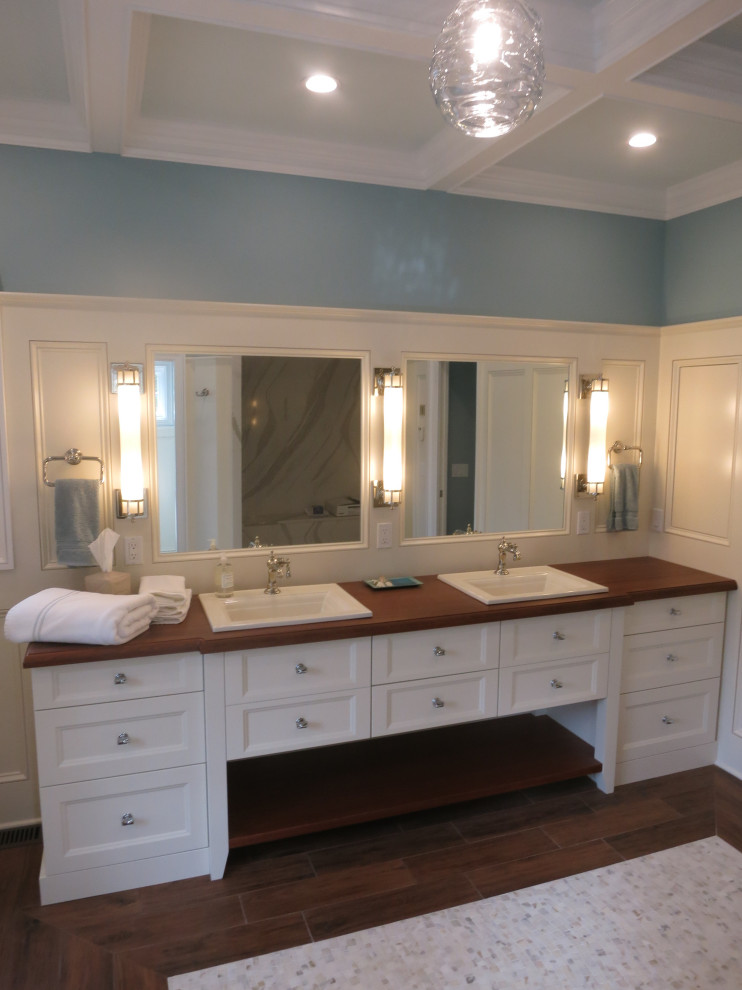 Inspiration for a large transitional master bathroom in Other with recessed-panel cabinets, white cabinets, wood benchtops, brown benchtops, a double vanity, a built-in vanity, multi-coloured walls, a vessel sink, brown floor, coffered and decorative wall panelling.
