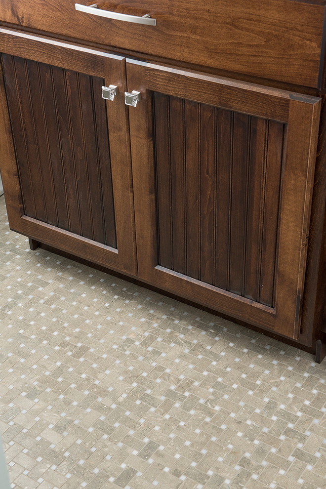 Bathroom - mid-sized transitional 3/4 brown tile and matchstick tile brown floor bathroom idea with recessed-panel cabinets, dark wood cabinets, a one-piece toilet, gray walls, an undermount sink and granite countertops