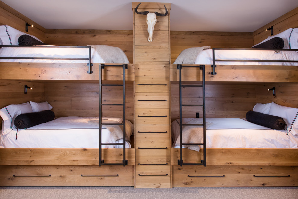 Vail Ski Haus - Bedroom and mid-sized mountain style gender-neutral carpeted and gray floor kids' bedroom photo in Denver with brown walls