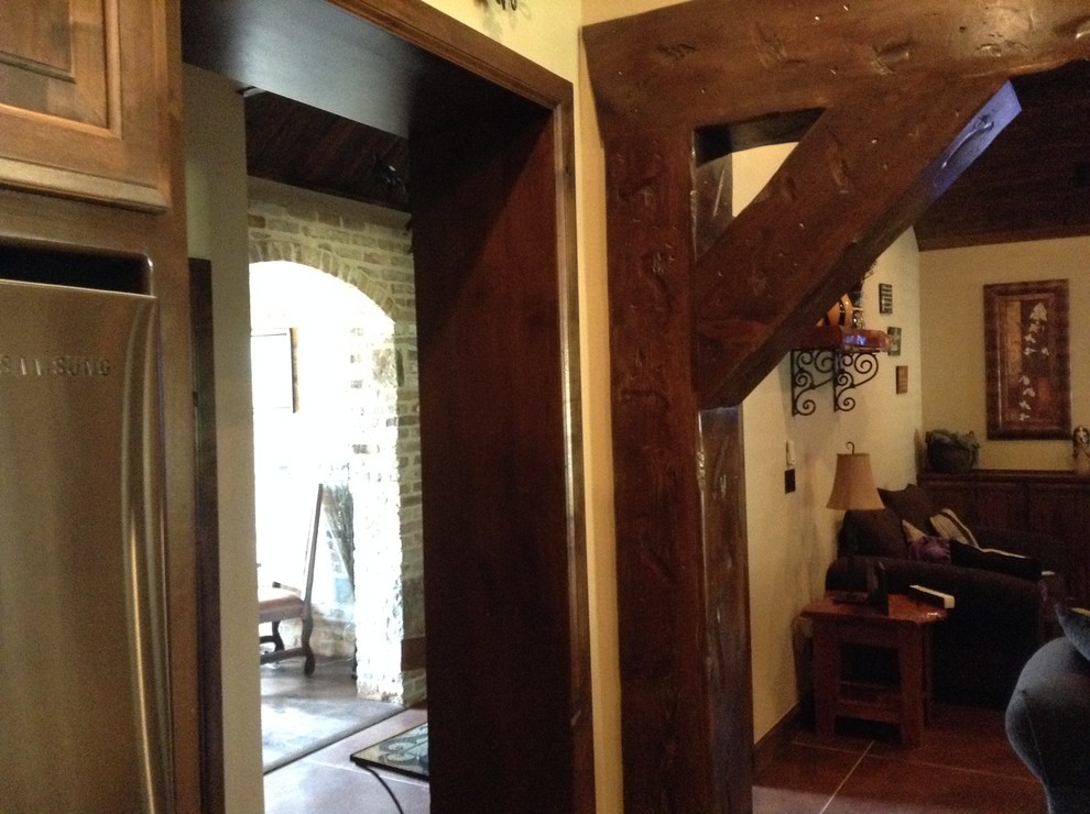 Foyer - mid-sized rustic foyer idea with beige walls