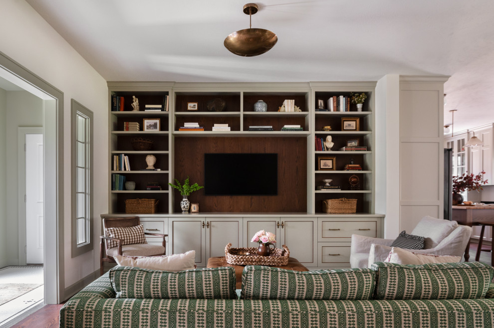 Family room - traditional open concept dark wood floor and brown floor family room idea with white walls and a wall-mounted tv