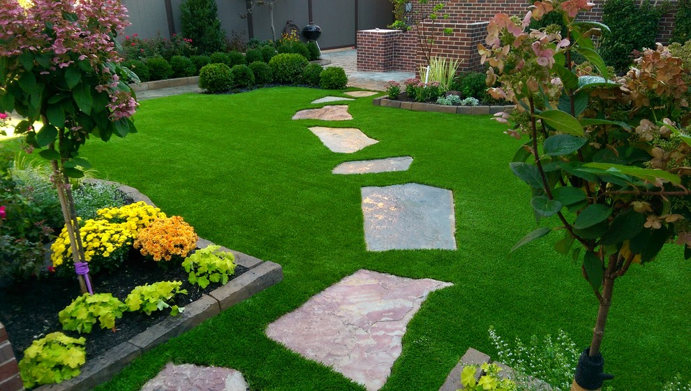 Suburban Backyard Artificial Turf Hardscape Flagstone Foliage