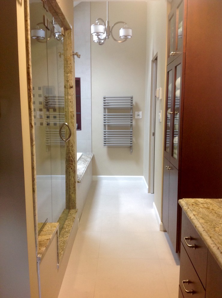 Large transitional master beige tile and porcelain tile porcelain tile home design photo in Boston with an undermount sink, flat-panel cabinets, dark wood cabinets, granite countertops, a wall-mount toilet and beige walls