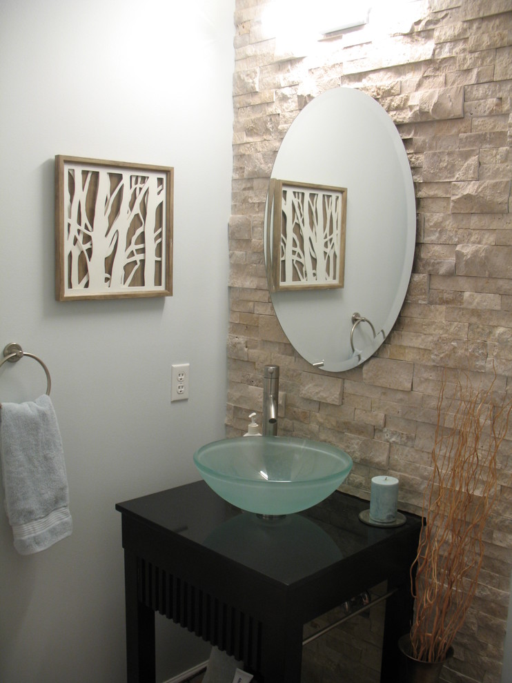 Contemporary powder room in Philadelphia with dark wood cabinets, granite benchtops, beige tile and travertine.