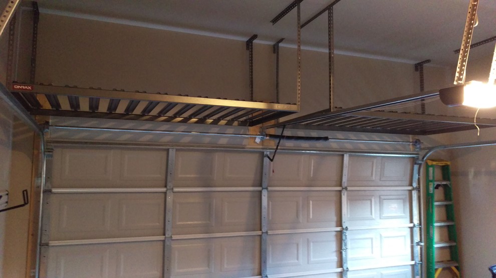 Inspiration for a mid-sized transitional attached two-car home design remodel in Denver