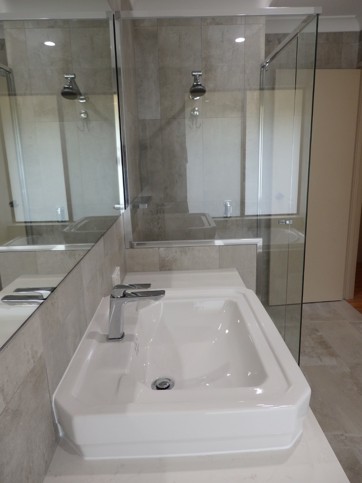 Inspiration for a large industrial master bathroom in Perth with shaker cabinets, white cabinets, a drop-in tub, cement tile, porcelain floors, a drop-in sink and engineered quartz benchtops.