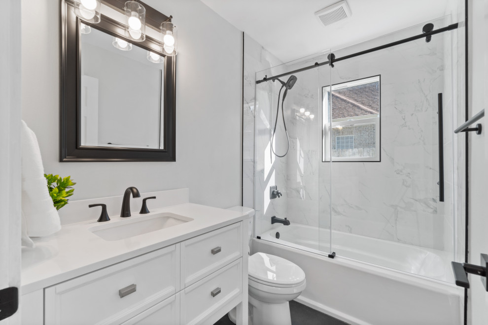 Example of a mid-sized transitional white tile black floor and single-sink sliding shower door design in San Diego with white cabinets, white countertops and a freestanding vanity