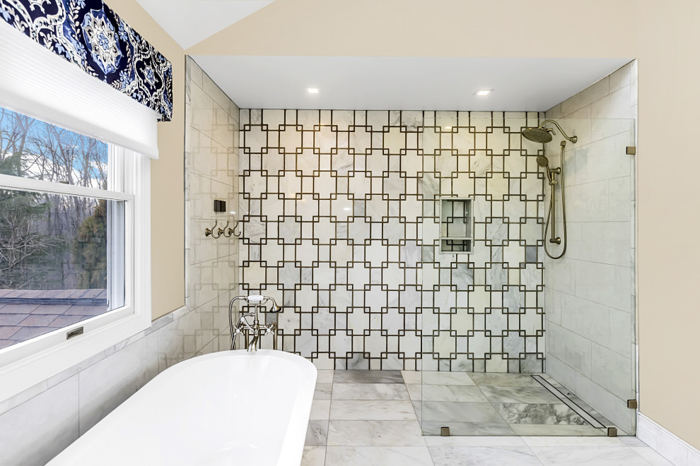 Freestanding bathtub - large transitional master gray tile and marble tile marble floor, gray floor, double-sink and vaulted ceiling freestanding bathtub idea in Philadelphia with shaker cabinets, white cabinets, a bidet, beige walls, an undermount sink, marble countertops, gray countertops and a freestanding vanity