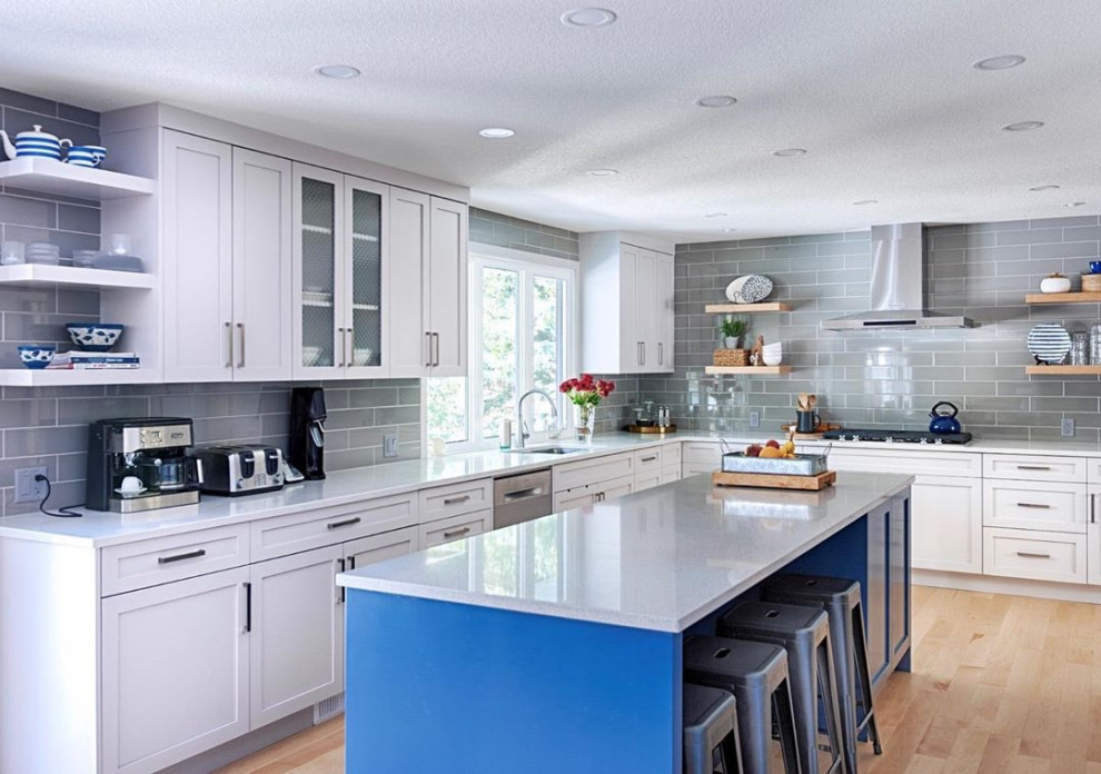 Example of a transitional kitchen design in Calgary