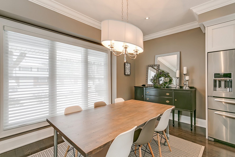 Small transitional dark wood floor and brown floor great room photo in Toronto with beige walls and no fireplace