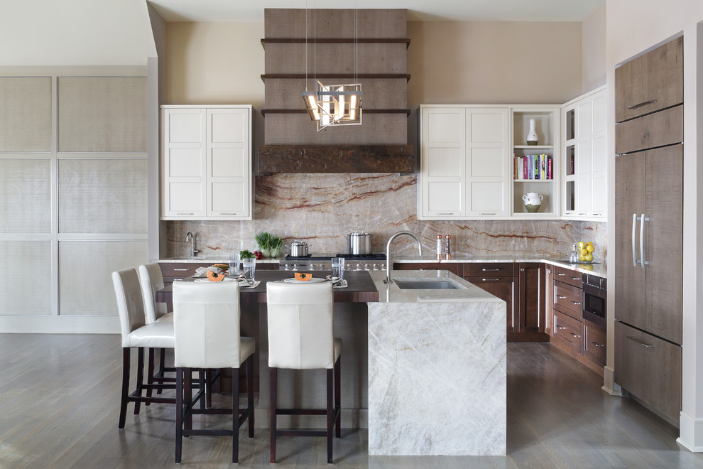 Open concept kitchen - large transitional l-shaped light wood floor open concept kitchen idea in New York with an undermount sink, flat-panel cabinets, medium tone wood cabinets, quartzite countertops, yellow backsplash, stone slab backsplash, paneled appliances and an island