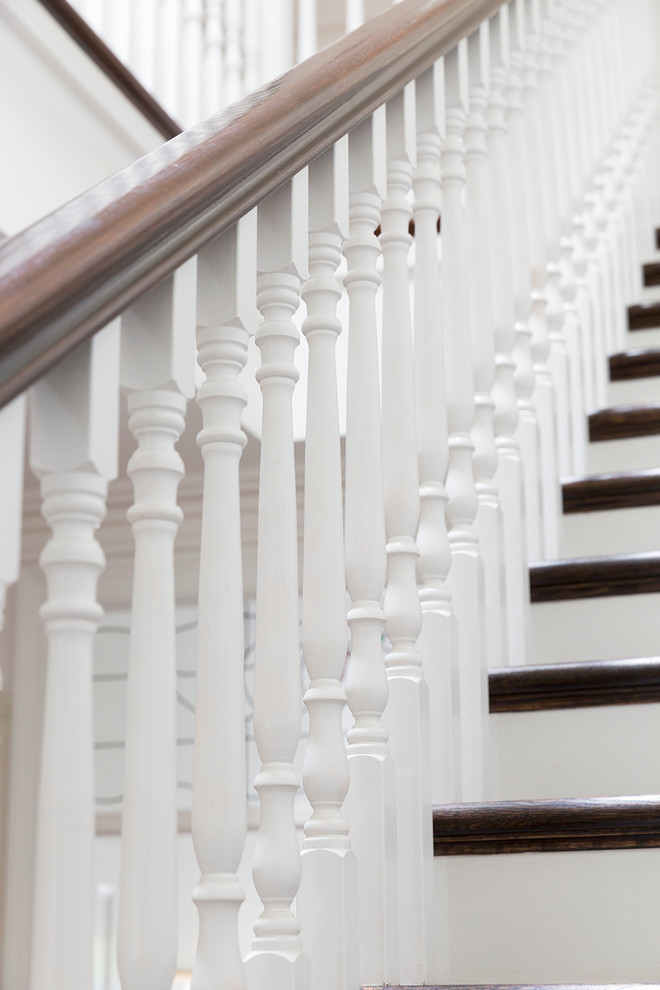 Mid-sized traditional wood straight staircase in Melbourne with wood risers.