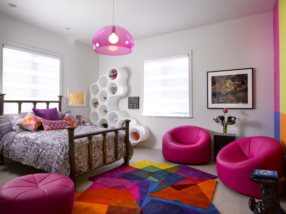 This is an example of a contemporary kids' room for girls in Miami with white walls and carpet.