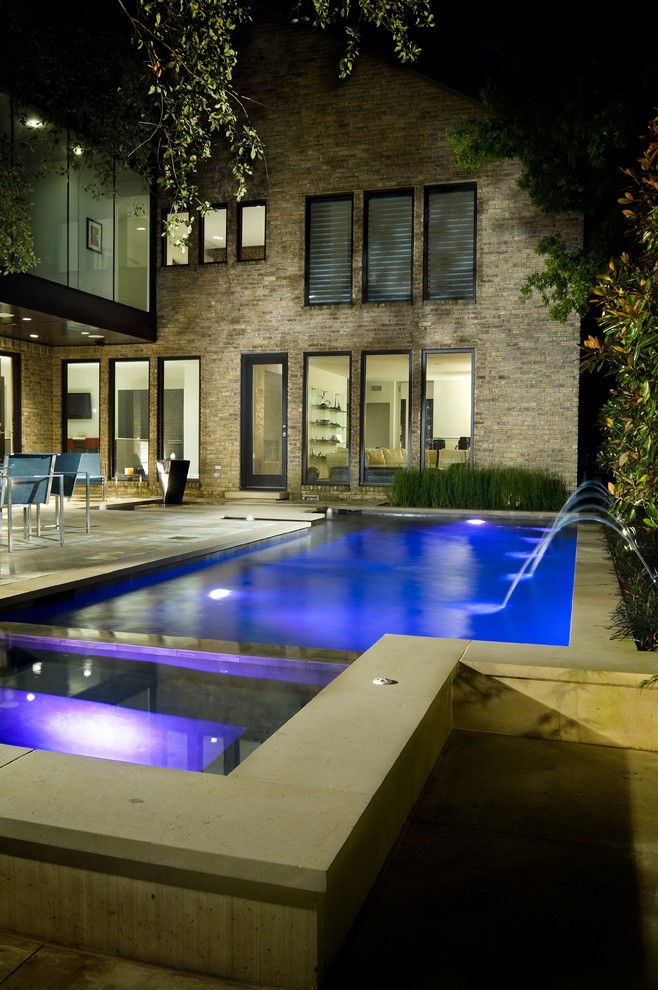This is an example of a contemporary rectangular pool in Dallas.