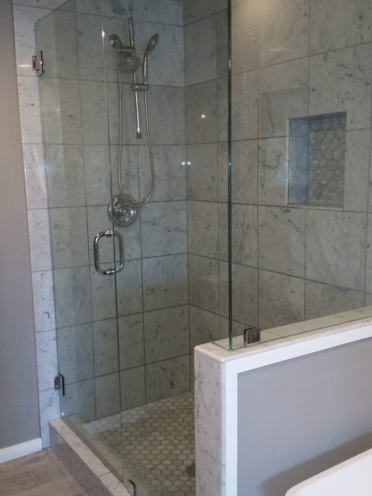 Mid-sized traditional master bathroom in Los Angeles with an undermount sink, shaker cabinets, grey cabinets, marble benchtops, a freestanding tub, an alcove shower, a two-piece toilet, gray tile, ceramic tile, grey walls and ceramic floors.