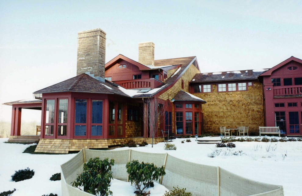 Inspiration for an expansive country two-storey red house exterior in Bridgeport with wood siding and a shingle roof.
