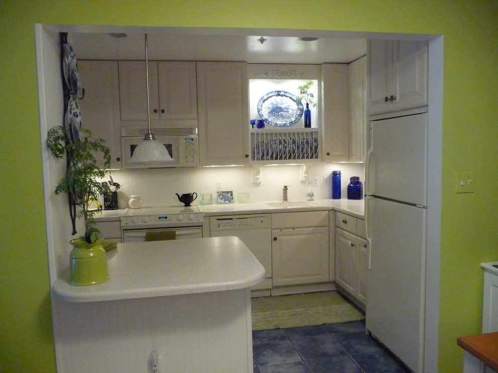 Design ideas for an eclectic kitchen in DC Metro with white appliances.