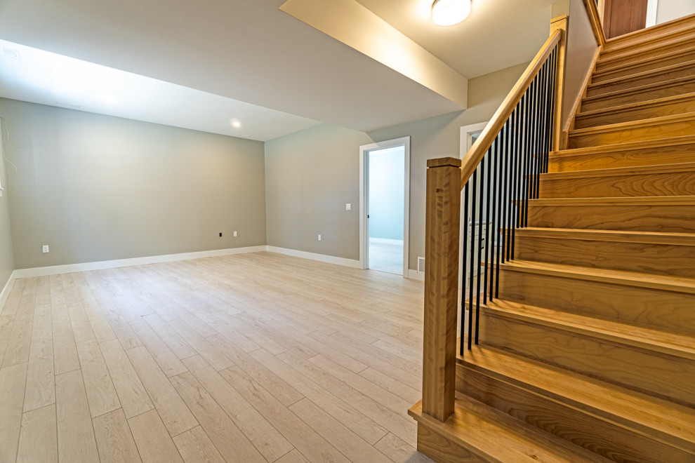 Basement - mid-sized transitional look-out beige floor basement idea with beige walls