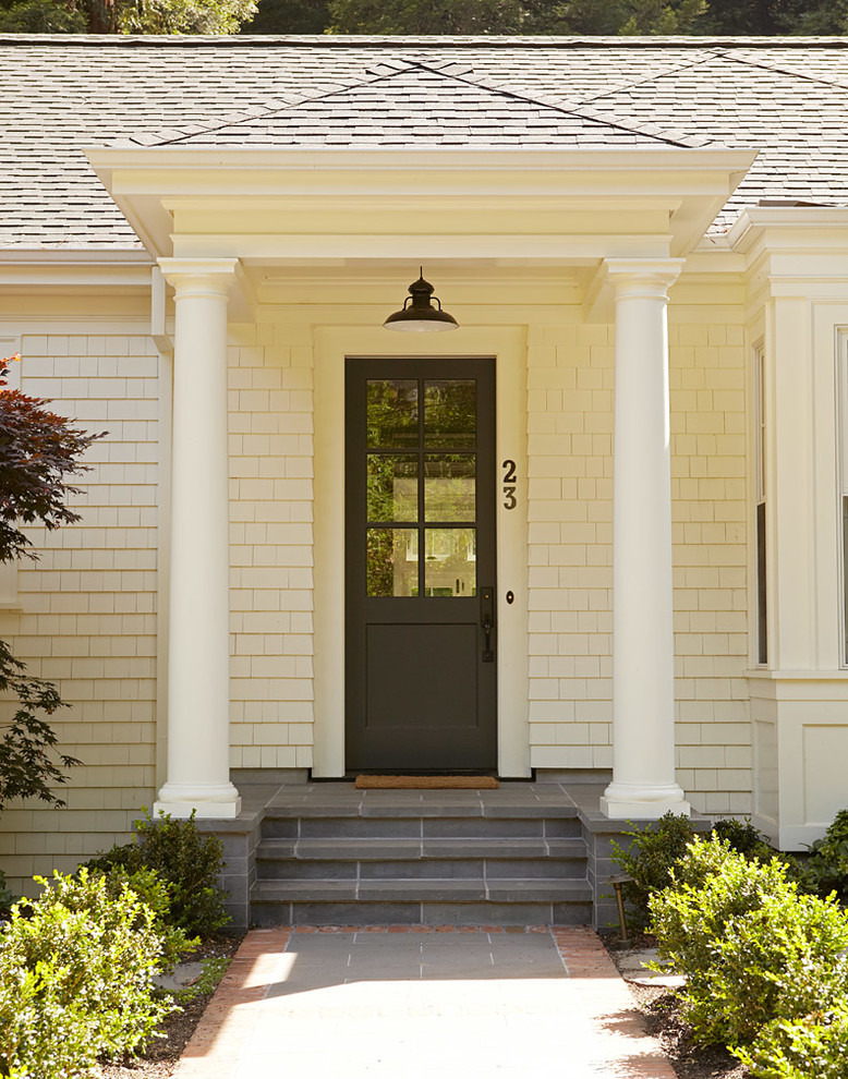 Traditional entryway in San Francisco with a single front door and a glass front door.