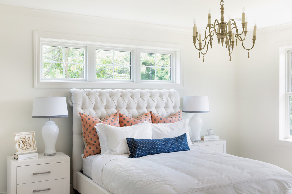 This is an example of a transitional bedroom in Minneapolis with white walls.
