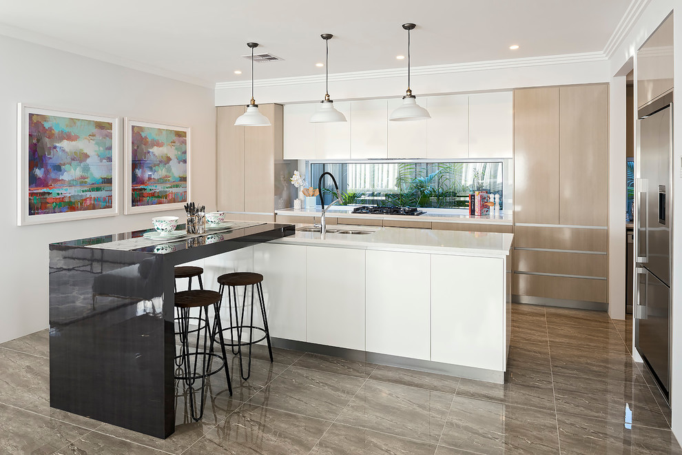 Mid-sized contemporary galley open plan kitchen in Perth with a double-bowl sink, flat-panel cabinets, beige cabinets, quartz benchtops, glass sheet splashback, stainless steel appliances, porcelain floors and with island.