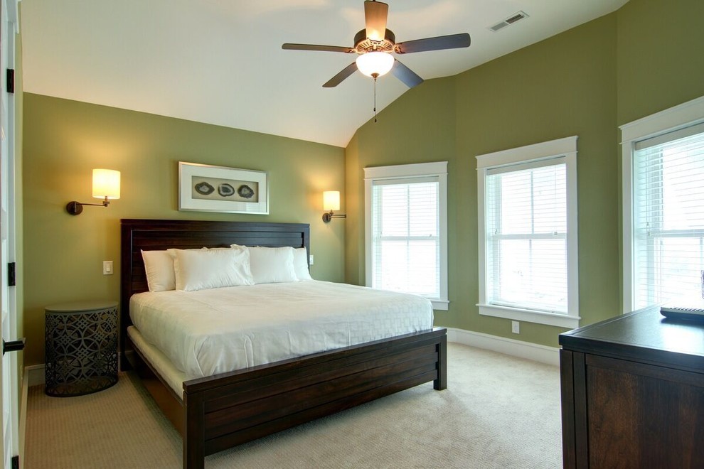 This is an example of a mid-sized beach style guest bedroom in Other with blue walls, carpet and no fireplace.