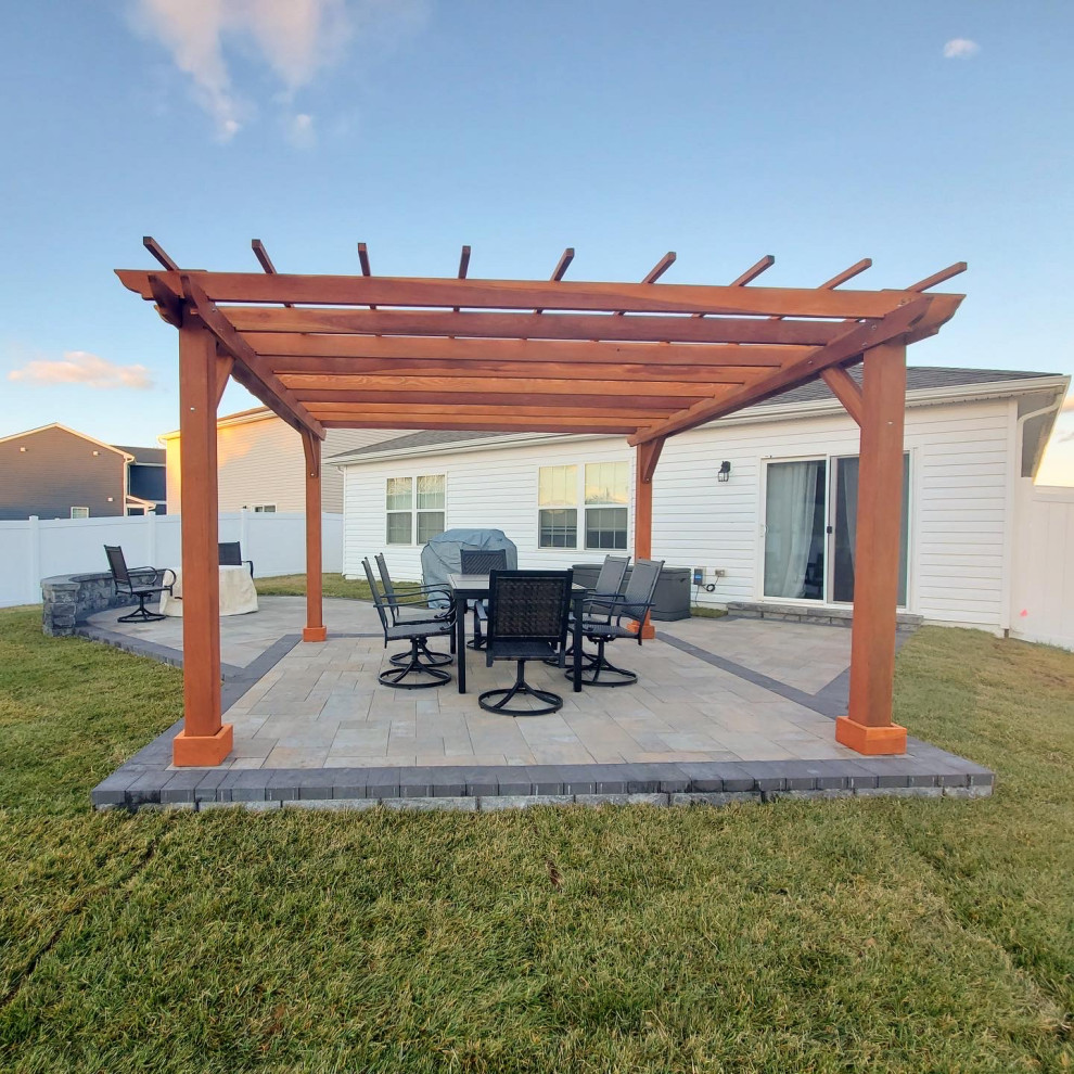 Design ideas for a mid-sized traditional backyard patio in San Diego with a pergola.