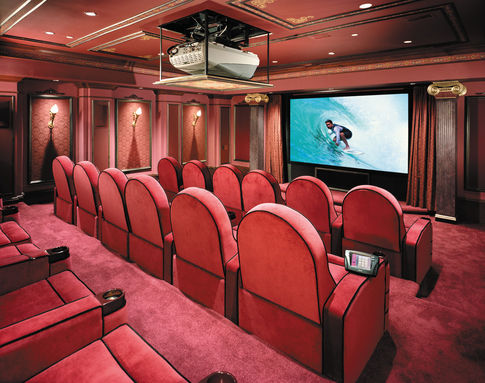 Traditional enclosed home theatre in New York with red walls, carpet, a projector screen and red floor.