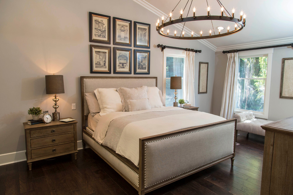 Large traditional bedroom in San Francisco with grey walls and dark hardwood floors.