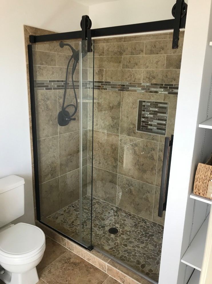 Example of a mid-sized transitional brown tile and porcelain tile alcove shower design in Phoenix with white walls