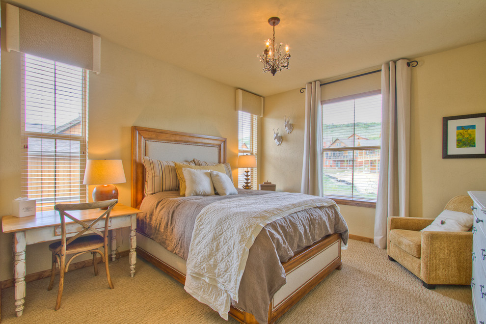 Mid-sized traditional master bedroom in Denver with beige walls, carpet, no fireplace and brown floor.
