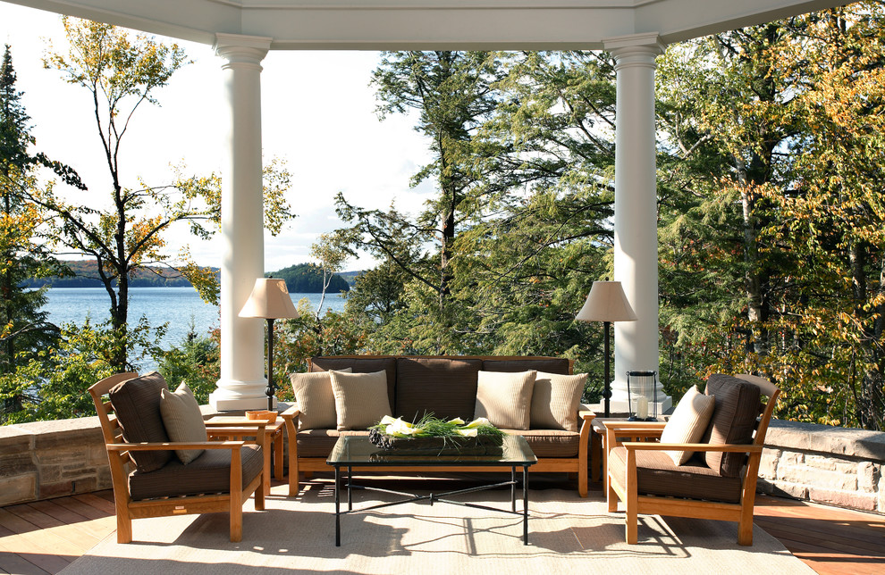 14 Years After - Stunning Sophistication in a Cabin on a Lake - Large transitional back porch photo in Atlanta with decking and a roof extension