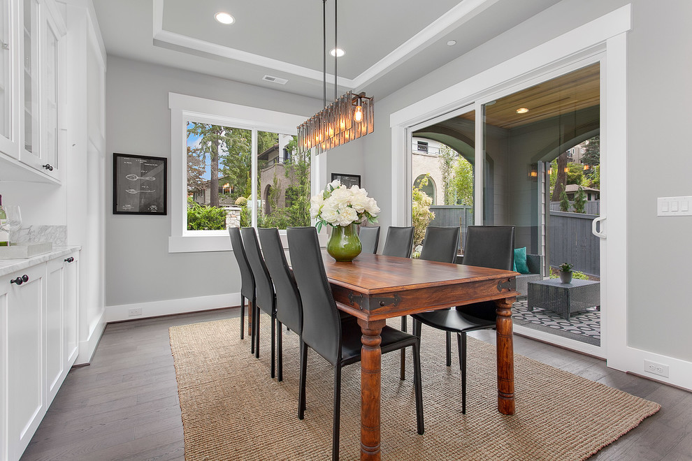 Large transitional kitchen/dining combo in Seattle with grey walls and medium hardwood floors.